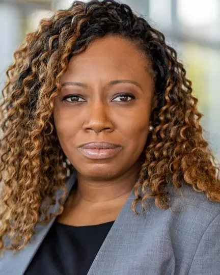 Alicia K. Biggs, mobile notary serving Richmond, Virginia, in a grey blazer