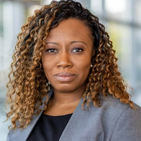 Alicia K. Biggs, mobile notary and certified signing agent serving Richmond Virginia, in a grey blazer